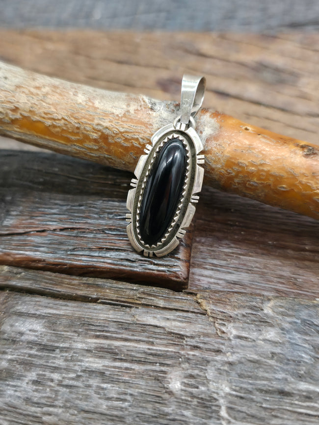Small Sterling Silver Onyx Pendant by S. Skeets - 1 1/2 in. by 1/2 in.