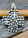 Cross-Shaped Sterling Silver Raindrop and Cross Pendant by Geneva Apachito