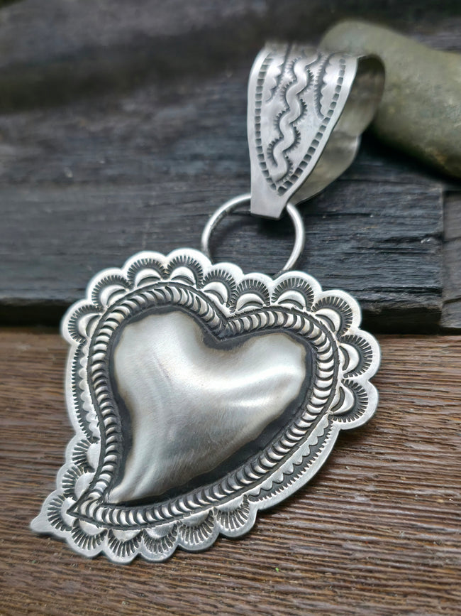 Sterling Silver Heart Pendant by Leander Tahe