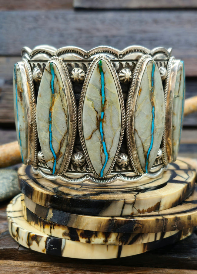 Wide Stamped Sterling Silver and Blue Gem Ribbon Turquoise Cuff by Delbert Delgarito