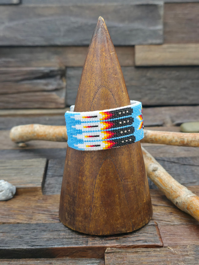 Beadwork Cuff - Starburst with Feathers on Blue - 7 in.