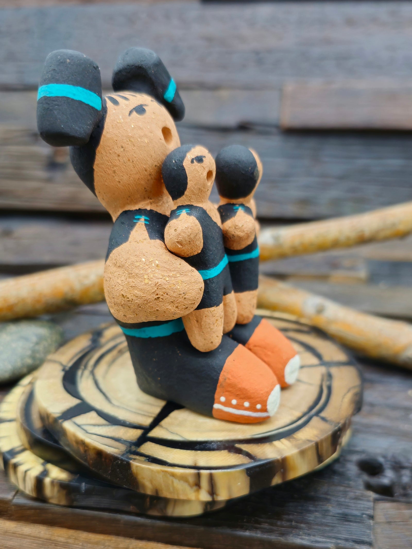 Taos Storyteller Figurine with Three Children, made with Micaceous Clay by Aaron M. - 3 1/2" by 3" by 2 1/2"
