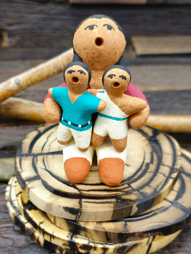 Taos Storyteller Figurine with Boy and Girl, made with Micaceous Clay by Aaron M. - 3 1/2" by 1 1/2" by 2 1/2"