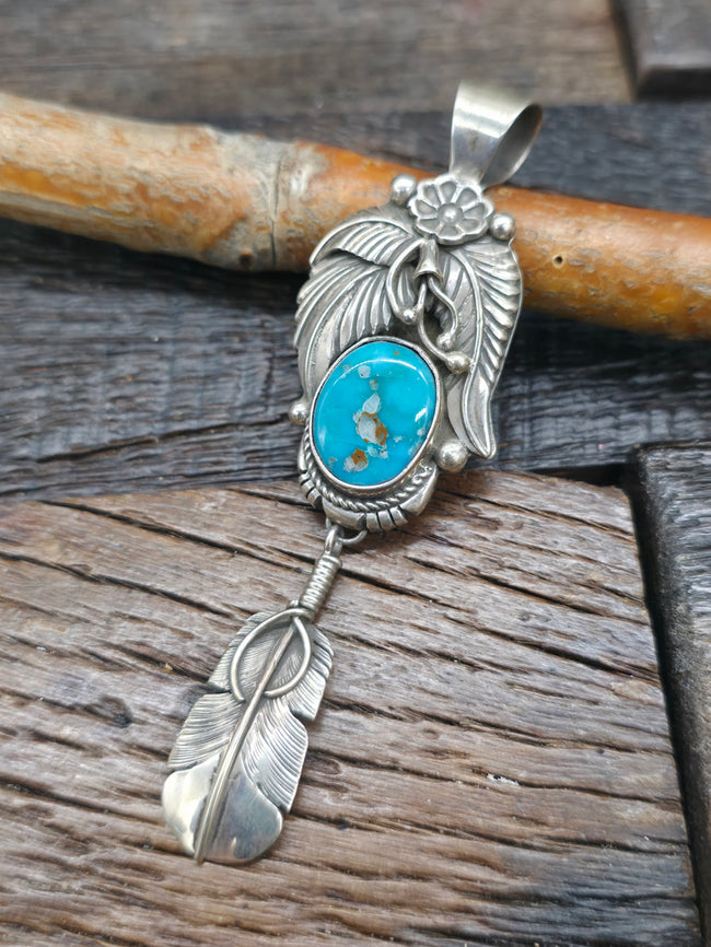 Sterling Silver Feather and Flower Pendant with Turquoise by Delbert Vandever - 3 /2 in. by 1 in.
