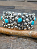 Chimney Butte Turquoise Sterling Silver Raindrop and Santa Fe Cross Cuff - 7 3/4 in.