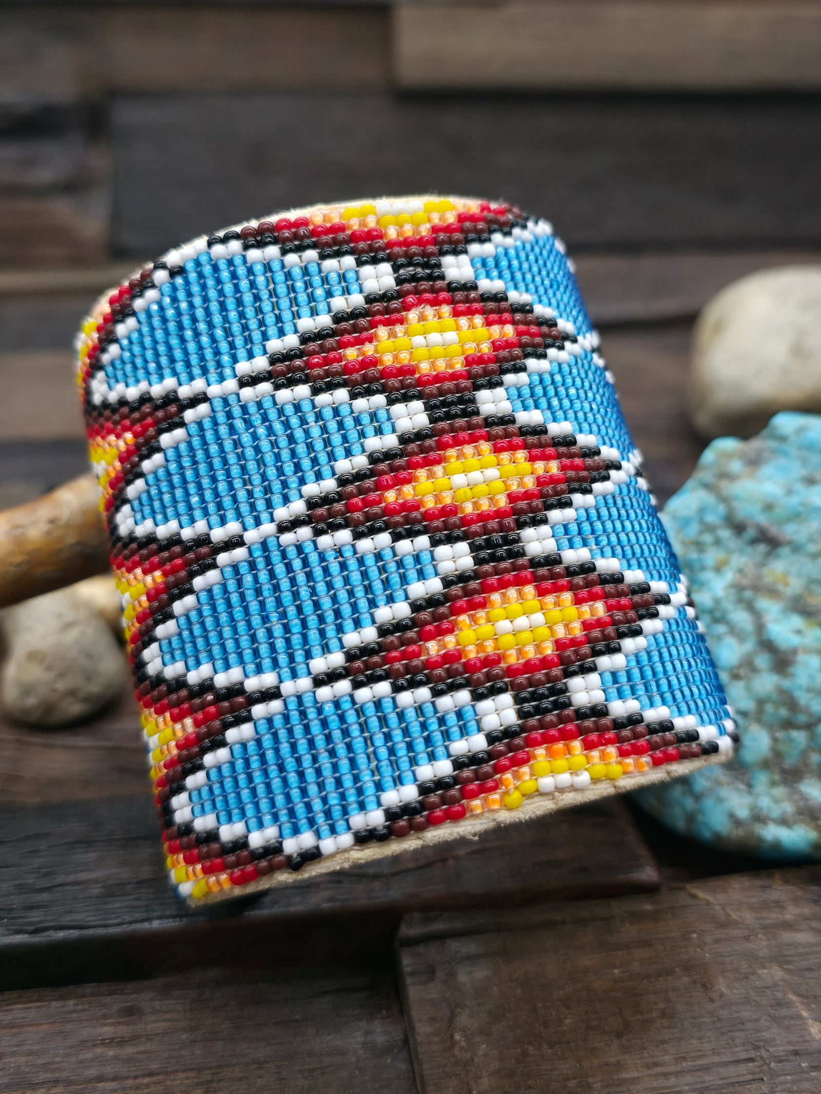 Wide Beadwork Cuff by Jacqueline Cleveland - White, Yellow, Orange, Red, Black on Blue - 7 1/4  in.