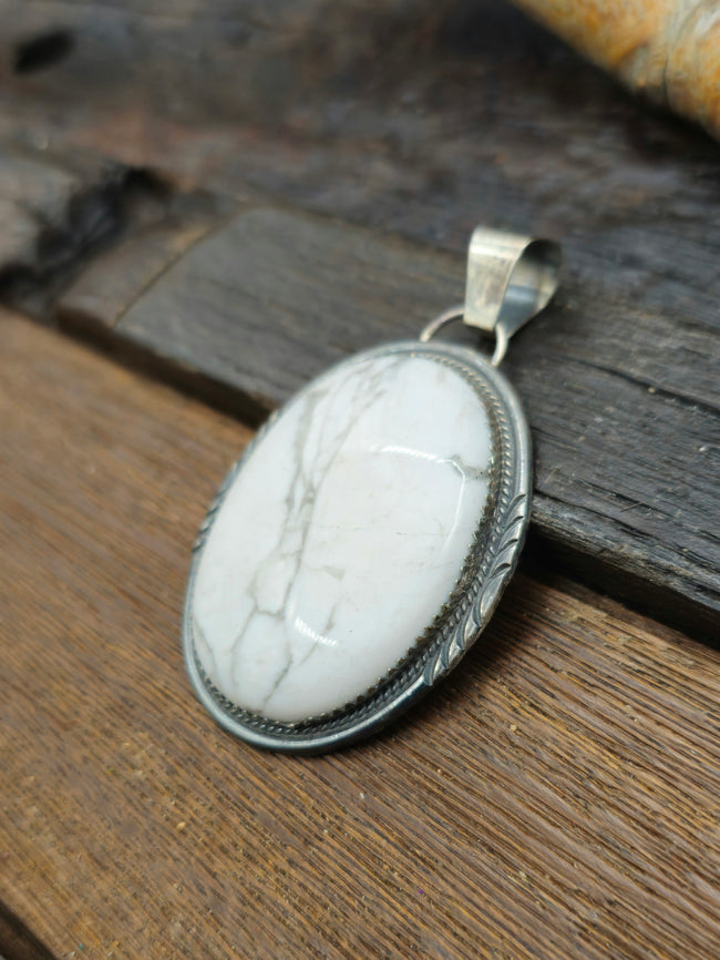 White Buffalo Sterling Silver Oval Pendant by Betty Begay