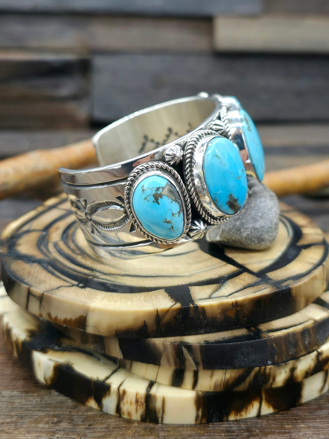 Stamped Sterling Silver and Kingman Turquoise Cuff by Delbert Delgarito  - 7 in.