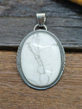 White Buffalo Sterling Silver Oval Pendant by Betty Begay