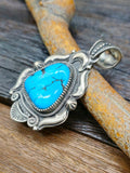 Turquoise and Sterling Silver Repousse Pendant by Richard Jim