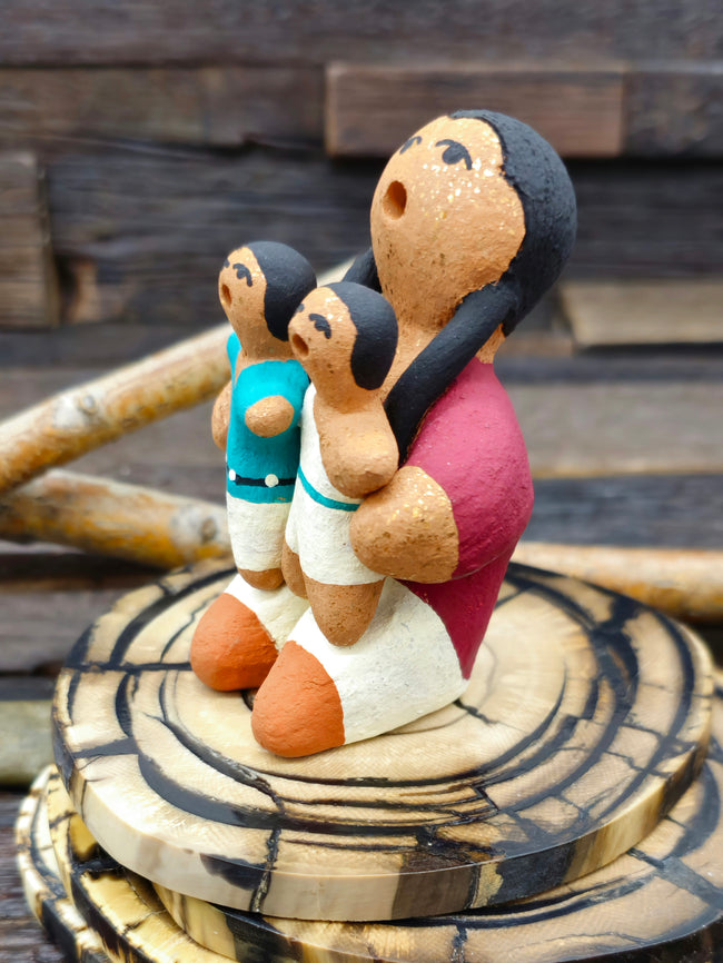 Taos Storyteller Figurine with Boy and Girl, made with Micaceous Clay by Aaron M. - 3 1/2" by 1 1/2" by 2 1/2"