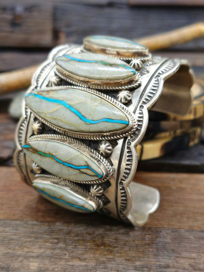 Wide Stamped Sterling Silver and Blue Gem Ribbon Turquoise Cuff by Delbert Delgarito