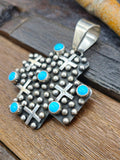Cross-Shaped Sterling Silver Raindrop and Turquoise Pendant by Geneva Apachito