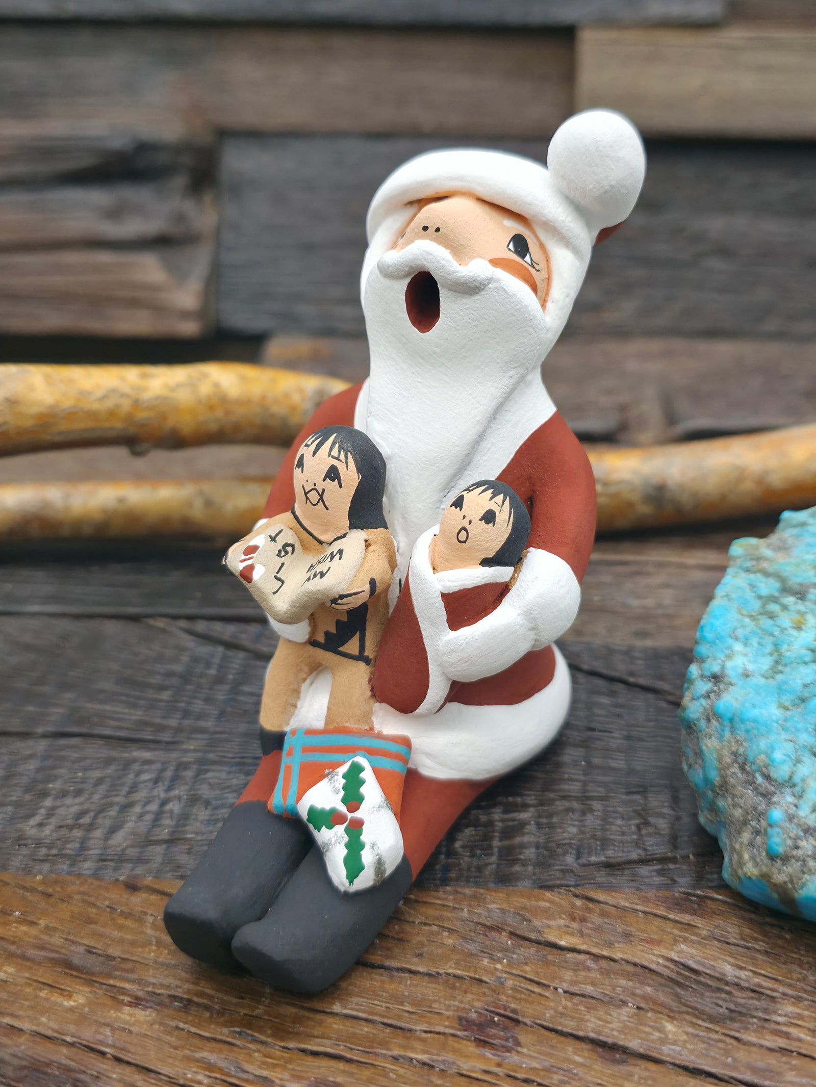 Seated Santa Claus Jemez Storyteller Figurine by D. Lucero - 4 in. by 2 in. by 3 1/2 in.