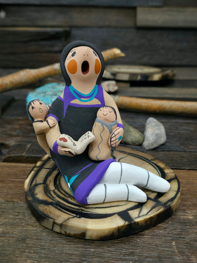 Jemez Storyteller Figurine with Two Children and Book, made by D. Lucero - 3 1/4" by 2 1/2" by 3"