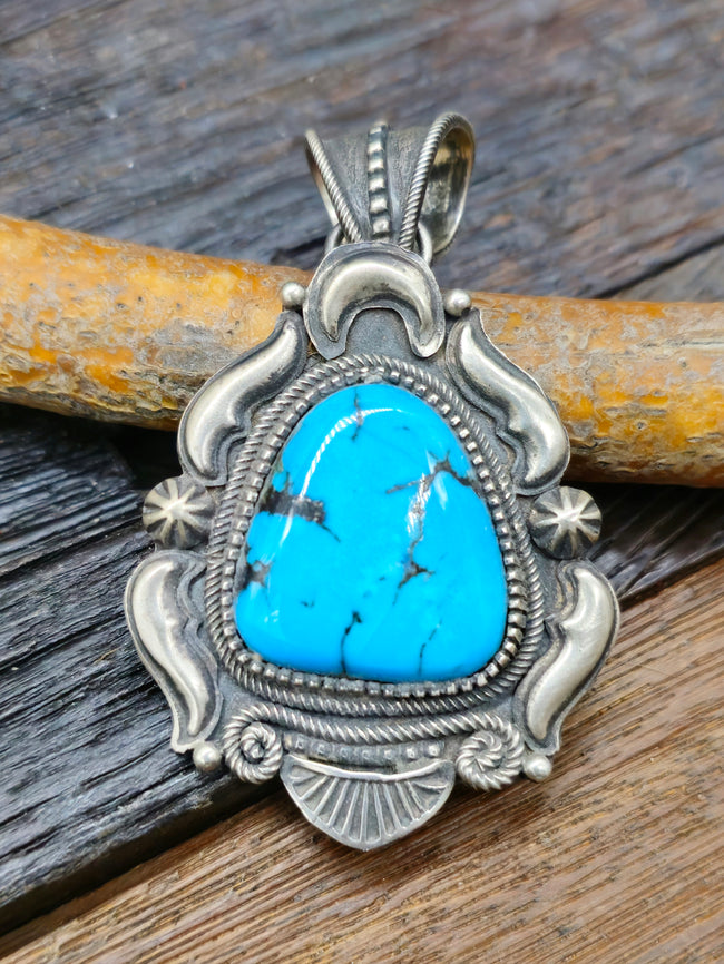 Turquoise and Sterling Silver Repousse Pendant by Richard Jim