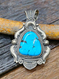 Turquoise and Sterling Silver Repousse Pendant by Richard Jim