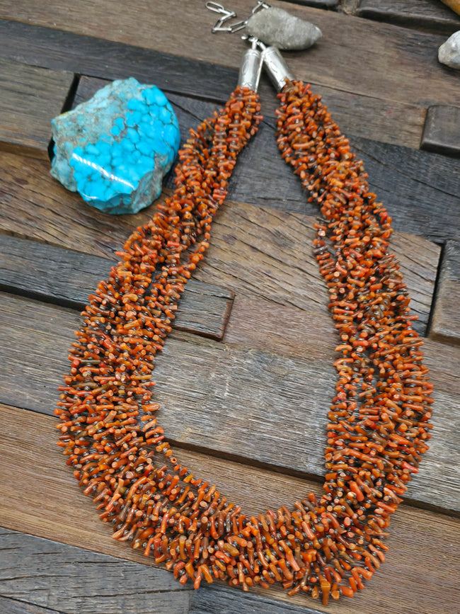Nine Strand Coral and Olive Shell Necklace with Stamped Sterling Silver Caps by Mel Masquat - 28 in. Plus 5 in. Extender