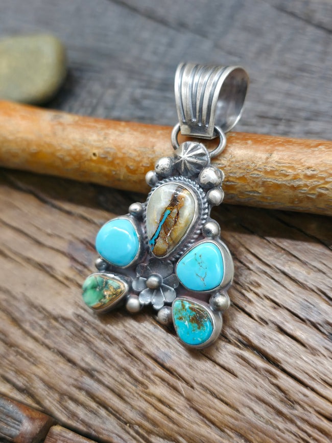 Sterling Silver Boulder and Candelaria Turquoise Half Cluster Pendant by LaRose Ganadanegro - 2 in. by 1 in.