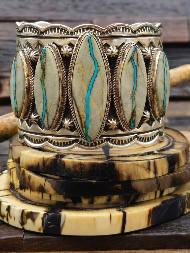 Wide Stamped Sterling Silver and Blue Gem Ribbon Turquoise Cuff by Delbert Delgarito