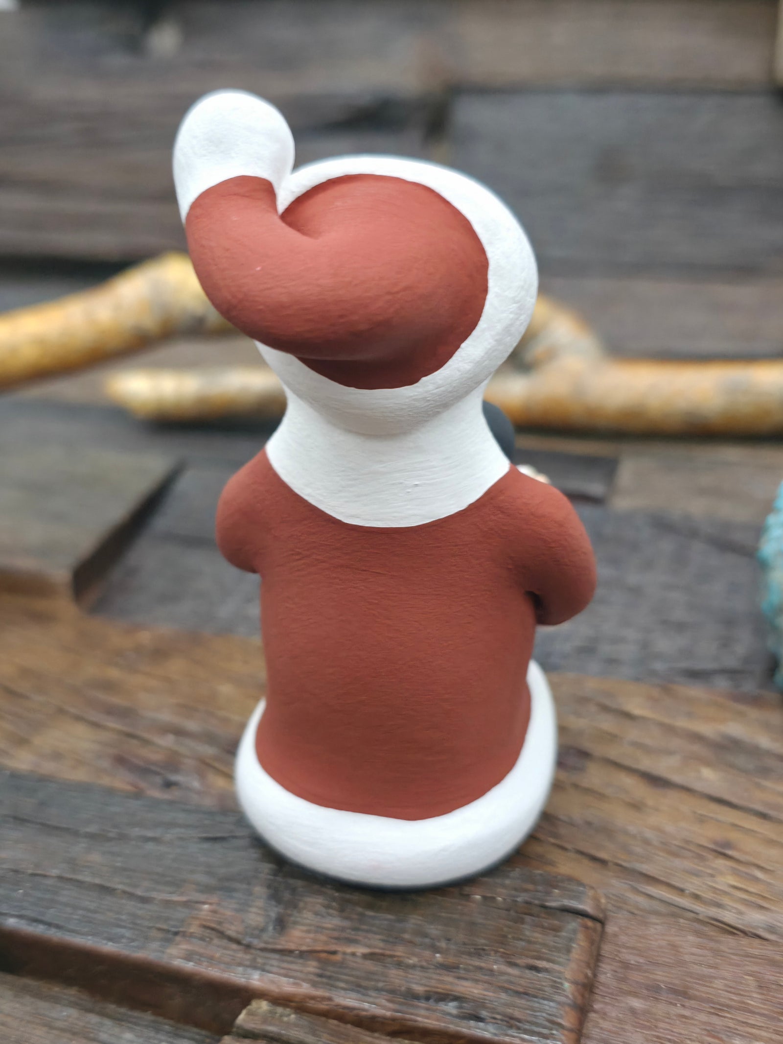 Seated Santa Claus Jemez Storyteller Figurine by D. Lucero - 4 in. by 2 in. by 3 1/2 in.