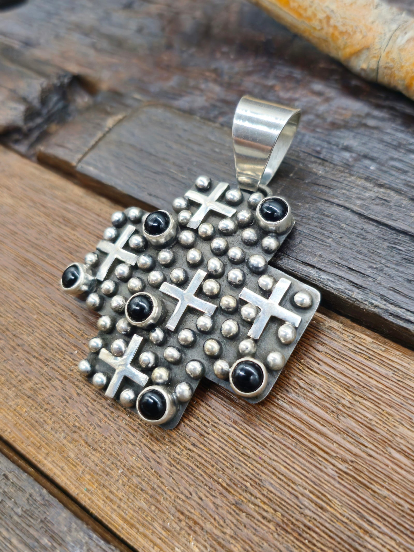 Cross-Shaped Sterling Silver Raindrop and Onyx Pendant by Geneva Apachito