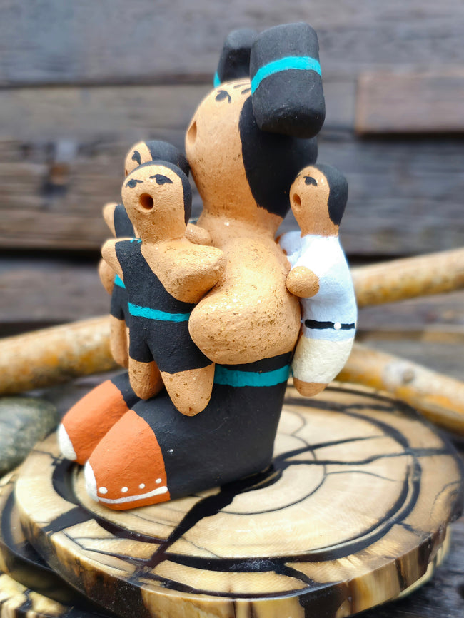 Taos Storyteller Figurine with Three Children, made with Micaceous Clay by Aaron M. - 3 1/2" by 3" by 2 1/2"