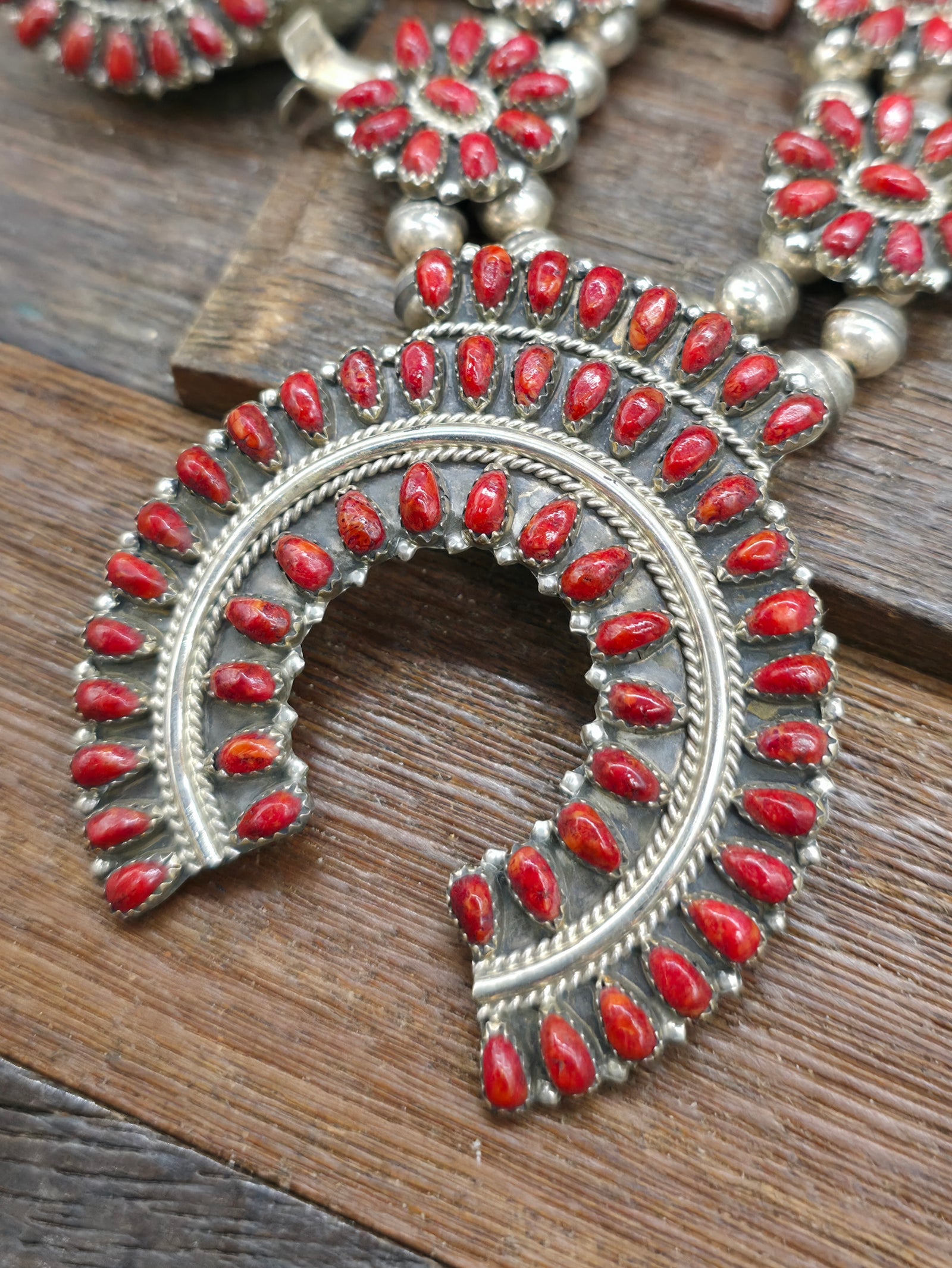 Seven Piece Sterling Silver Apple Coral Squash Blossom Necklace Set with Earrings, Two Adjustable Rings, Two Bracelets, and Pin/Pendant