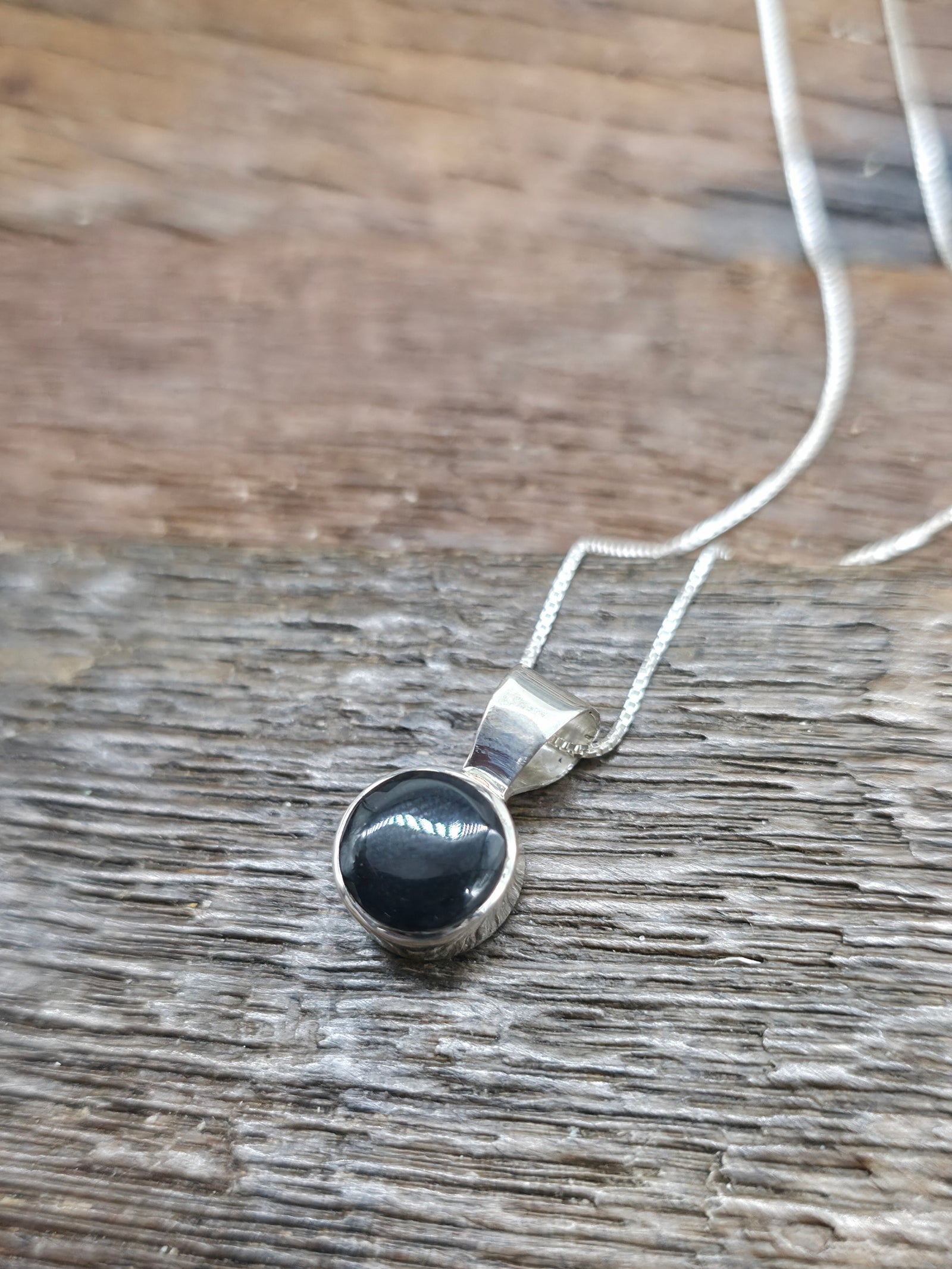 Round Sterling Silver Black Onyx Pendant on 18 in. Chain