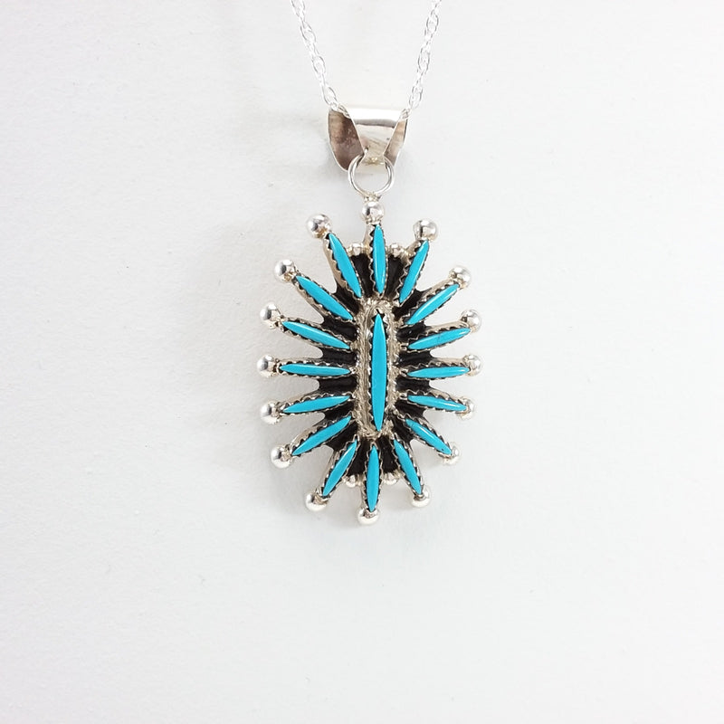 Gerald Etsate turquoise sterling silver needle point pendant