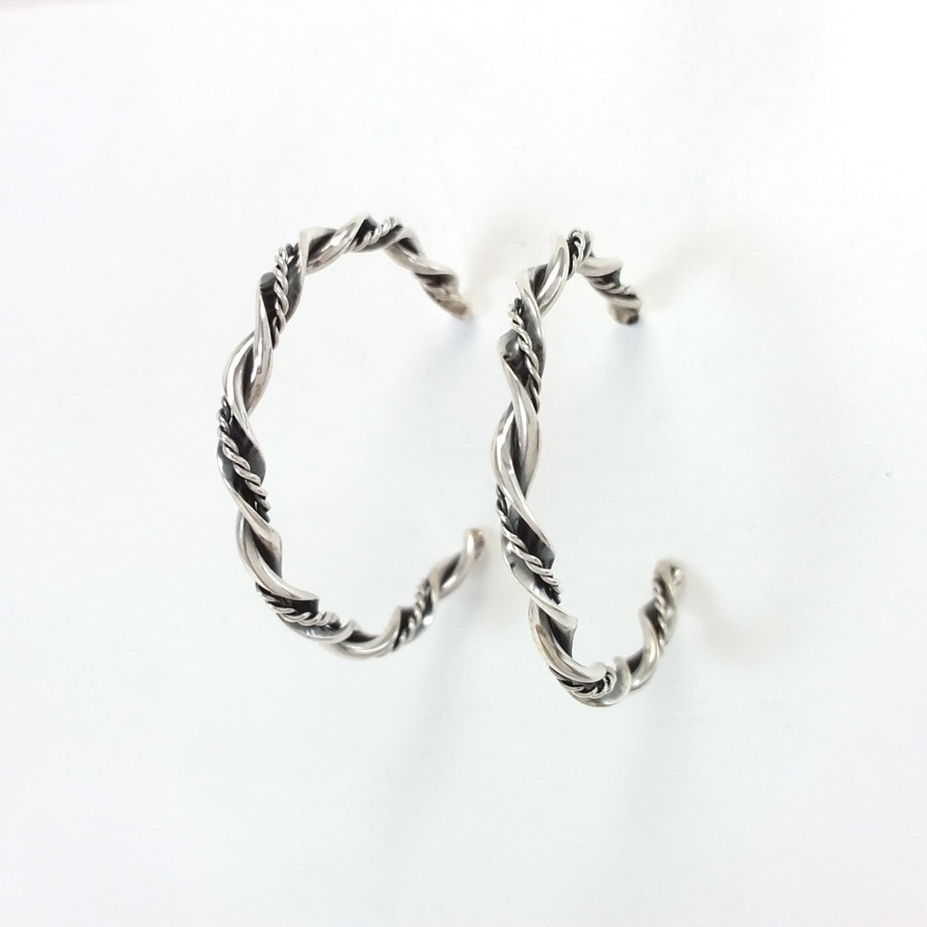 Navajo sterling silver twisted hoop earrings.
