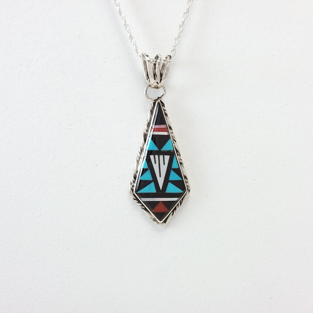 Zuni turquoiuse, coral, jet and mother of pearl sterling silver inlay pendant.