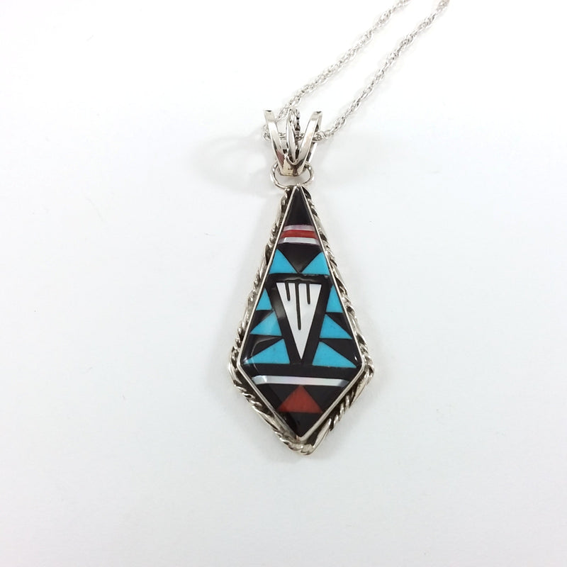 Zuni turquoiuse, coral, jet and mother of pearl sterling silver inlay pendant.