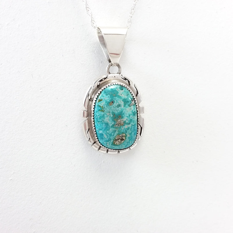 Peggy Skeets Navajo turquoise sterling silver pendant.