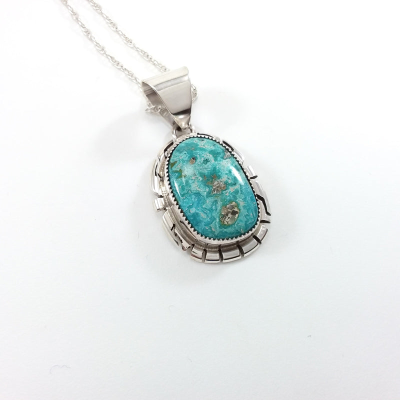 Peggy Skeets Navajo turquoise sterling silver pendant.