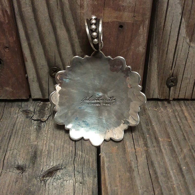 Jonathan Nez Navajo turquoise sterling silver pendant.